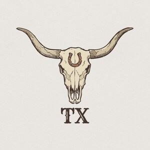 May include: A graphic illustration of a longhorn steer skull featuring a brown horseshoe centered on the forehead. The skull is rendered in shades of beige and tan with dark outlines. Below the skull, the letters TX are printed in a dark brown font.