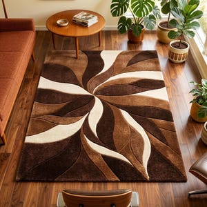 May include: A rectangular area rug with a swirling, floral-like pattern in shades of brown and cream. The rug is placed on a hardwood floor, and the design creates a sense of movement and depth. The rug is a focal point in a living room setting.