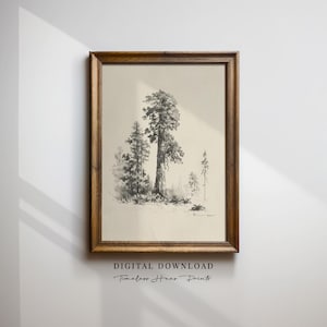 May include: A framed black and white print of a forest scene. The artwork features several trees of varying sizes, with a large tree in the center. The frame is made of wood. The text "DIGITAL DOWNLOAD Timeless Home Prints" is at the bottom.