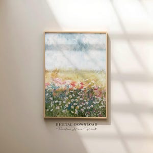 May include: A framed digital art print featuring a watercolor painting of a wildflower meadow. The artwork displays a field of colorful flowers in shades of pink, red, and white, under a light blue sky. The text "DIGITAL DOWNLOAD Timeless Home Prints" is at the bottom.