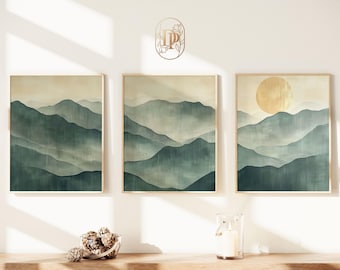 May include: Three framed watercolour paintings of a misty mountain landscape. The paintings are in shades of green and blue with a golden sun in the rightmost painting.