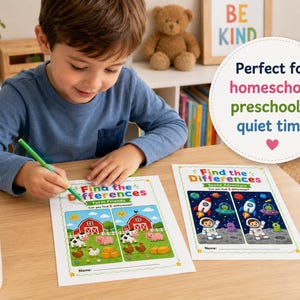May include: A young child is seated at a wooden table, working on a "Find the Differences" activity sheet with a green pencil. The sheet features colorful illustrations of farm animals and the text "Farm Friends". A second sheet shows a space theme.