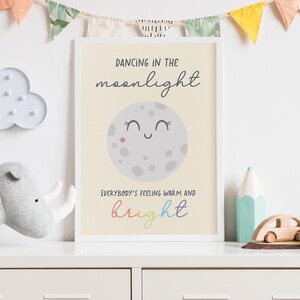 May include: A nursery print with a yellow background featuring a cartoon moon with a smiling face and the text "Dancing in the moonlight. Everybody's feeling warm and bright."