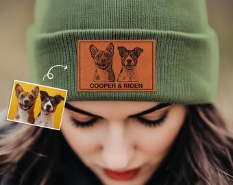 May include: Green knitted beanie with a brown leather patch featuring two dogs and the text "COOPER & RIDEN".