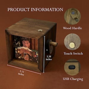 May include: A wooden photo cube with a crank and a touch switch. The cube displays a photo of a couple. The text "OUR LOVE STORY" and the date "09.14.2020" are engraved on the top. The cube measures 3.15 x 3.38 inches.