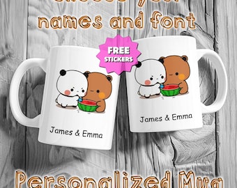 May include: Two white ceramic mugs with a cartoon panda and bear design, holding a watermelon slice. The mugs have the names "James & Emma" printed on them. The image also includes the text "Choose your names and font" and "Personalized Mug".