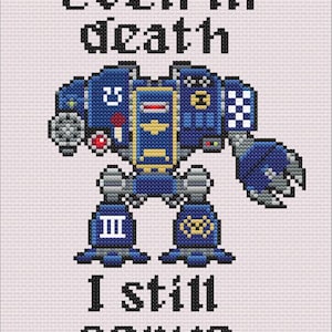May include: Cross-stitch design showing a blue and gold robot with the text "Even in death I still serve." The robot has detailed features and is set against a light background. The design has a science fiction theme.