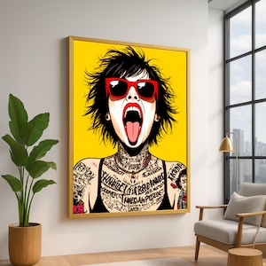 May include: Framed pop art print of a woman with black hair, red sunglasses, and an open mouth. The artwork has a yellow background and a gold frame. The woman has tattoos on her neck and arms.