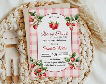 May include: A baby shower invitation with a pink gingham background and strawberry illustrations. The text reads "Berry Sweet is on the way" and includes details for Charlotte Miles' baby shower, set for October 25th at 3:00 PM.