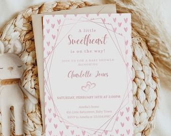 May include: A baby shower invitation with a pink and white design. The invitation features the text "A little Sweetheart is on the way!" and details for the event, including the honoree's name, date, and time. The invitation is decorated with small pink hearts.