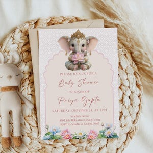 May include: A baby shower invitation featuring a cute elephant illustration holding a lotus flower, adorned with a crown. The invitation has a pink and white floral design, with the text "PLEASE JOIN US FOR A Baby Shower IN HONOR OF Priya Gupta".