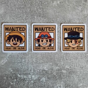 May include: Three cartoon character wanted posters with brown borders and white backgrounds. Each poster has the word "WANTED" in large, bold, brown letters at the top. The posters feature cartoon characters with different hairstyles and hats. The text "DEAD OR ALIVE" appears below each character.