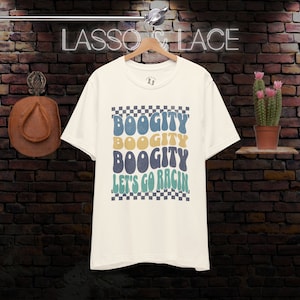 May include: White t-shirt with a checkered background and the text "Boogitty Boogitty Boogitty Let's Go Rac'n" in a retro font.