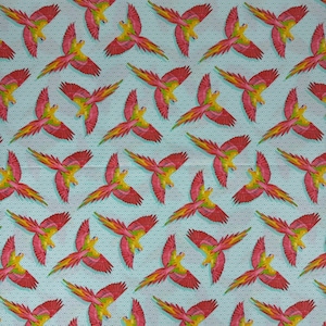 Tula Pink&#39;s Daydreamer - one fat quarter cut of the &quot;Macaw ya Later&quot; print, featuring warm macaws on an aqua geometric background.