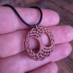 TreeOfLifePendant, YggdrasilJewelry, CelticNorseAmulet, ReclaimedWoodArt, CelticKnotworkPendant, VikingSymbolism, MythologyInspired, HandmadePendant, NorseCelticArt, HistoricalJewelry, NatureLoversGift, EternalLifeSymbol, CelticHighlandArt