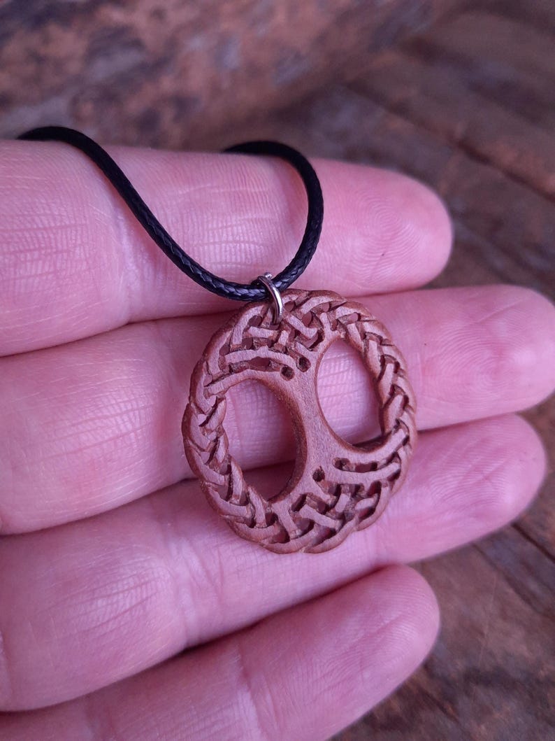 TreeOfLifePendant, YggdrasilJewelry, CelticNorseAmulet, ReclaimedWoodArt, CelticKnotworkPendant, VikingSymbolism, MythologyInspired, HandmadePendant, NorseCelticArt, HistoricalJewelry, NatureLoversGift, EternalLifeSymbol, CelticHighlandArt