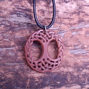TreeOfLifePendant, YggdrasilJewelry, CelticNorseAmulet, ReclaimedWoodArt, CelticKnotworkPendant, VikingSymbolism, MythologyInspired, HandmadePendant, NorseCelticArt, HistoricalJewelry, NatureLoversGift, EternalLifeSymbol, CelticHighlandArt