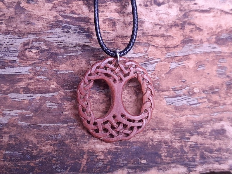 TreeOfLifePendant, YggdrasilJewelry, CelticNorseAmulet, ReclaimedWoodArt, CelticKnotworkPendant, VikingSymbolism, MythologyInspired, HandmadePendant, NorseCelticArt, HistoricalJewelry, NatureLoversGift, EternalLifeSymbol, CelticHighlandArt