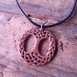TreeOfLifePendant, YggdrasilJewelry, CelticNorseAmulet, ReclaimedWoodArt, CelticKnotworkPendant, VikingSymbolism, MythologyInspired, HandmadePendant, NorseCelticArt, HistoricalJewelry, NatureLoversGift, EternalLifeSymbol, CelticHighlandArt