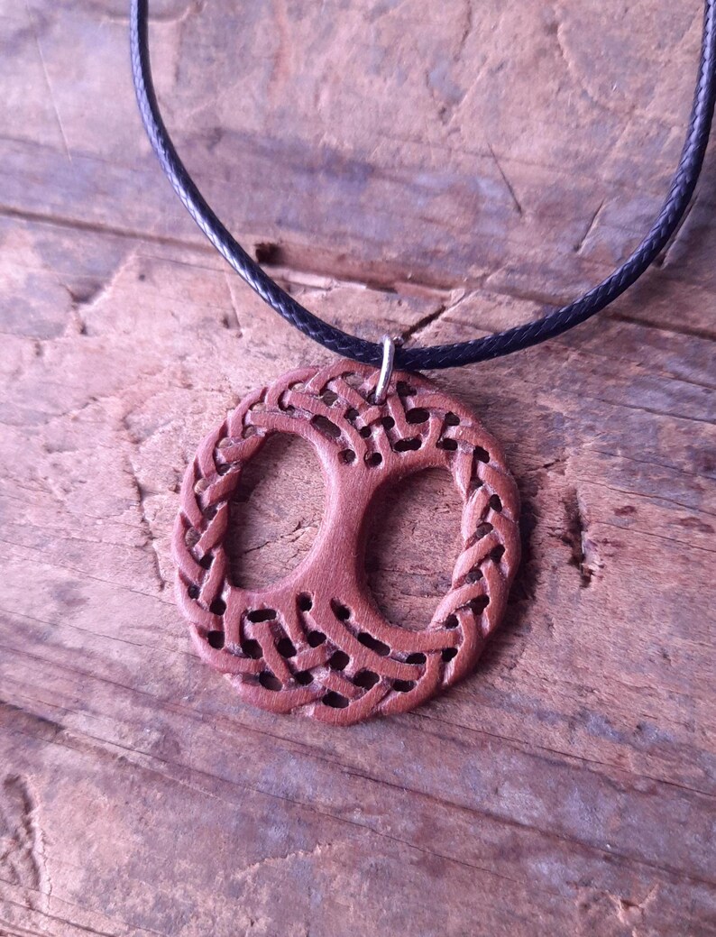 TreeOfLifePendant, YggdrasilJewelry, CelticNorseAmulet, ReclaimedWoodArt, CelticKnotworkPendant, VikingSymbolism, MythologyInspired, HandmadePendant, NorseCelticArt, HistoricalJewelry, NatureLoversGift, EternalLifeSymbol, CelticHighlandArt