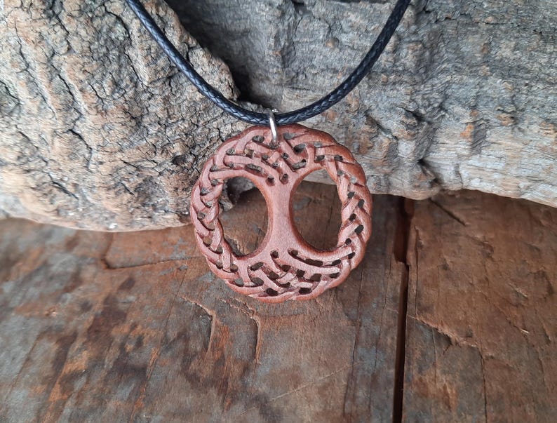 TreeOfLifePendant, YggdrasilJewelry, CelticNorseAmulet, ReclaimedWoodArt, CelticKnotworkPendant, VikingSymbolism, MythologyInspired, HandmadePendant, NorseCelticArt, HistoricalJewelry, NatureLoversGift, EternalLifeSymbol, CelticHighlandArt