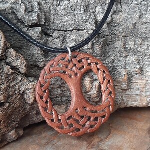 TreeOfLifePendant, YggdrasilJewelry, CelticNorseAmulet, ReclaimedWoodArt, CelticKnotworkPendant, VikingSymbolism, MythologyInspired, HandmadePendant, NorseCelticArt, HistoricalJewelry, NatureLoversGift, EternalLifeSymbol, CelticHighlandArt