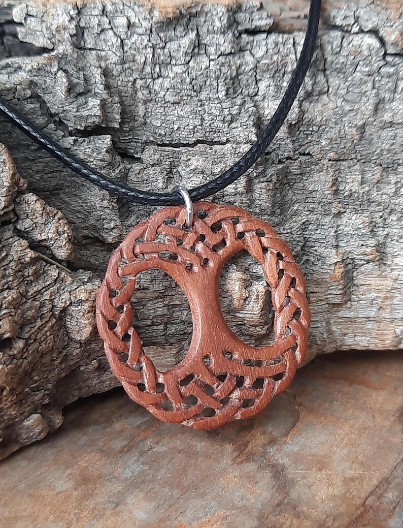 TreeOfLifePendant, YggdrasilJewelry, CelticNorseAmulet, ReclaimedWoodArt, CelticKnotworkPendant, VikingSymbolism, MythologyInspired, HandmadePendant, NorseCelticArt, HistoricalJewelry, NatureLoversGift, EternalLifeSymbol, CelticHighlandArt