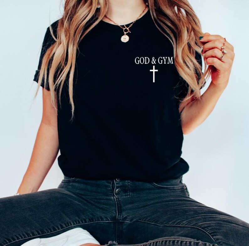 May include: A black t-shirt with the text "GOD & GYM" and a white cross.