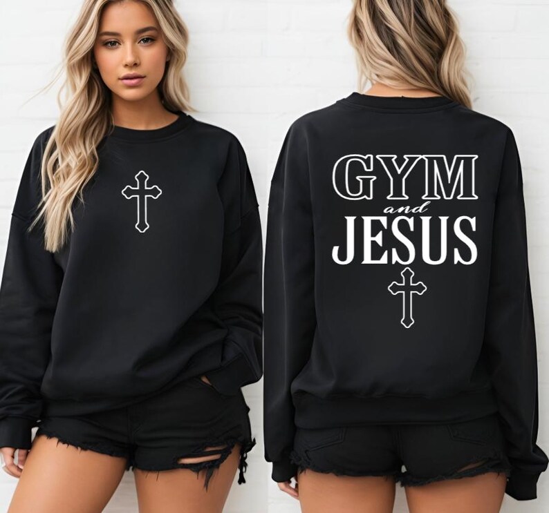 May include: Black sweatshirt with the text "GYM and JESUS" and a cross on the back. The front of the sweatshirt has a cross.