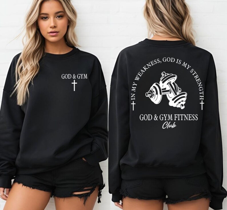 May include: Black sweatshirt with white text and a cross on the front. The back of the sweatshirt has a white graphic of dumbbells with the text "In my weakness, God is my strength + God & Gym Fitness Club".