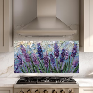 May include: A mosaic tile backsplash featuring a lavender field. The artwork showcases purple lavender flowers with green stems against a mosaic background of blue, white, and yellow tiles. The backsplash is installed above a gas stove.