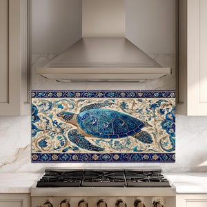 May include: A rectangular kitchen backsplash panel featuring a central blue sea turtle surrounded by intricate floral and vine patterns in shades of blue, cream, and gold, framed by a decorative dark blue border with repeating star motifs.