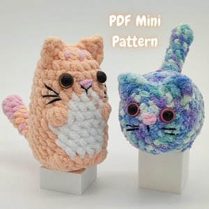 Two plush amigurumi mini kittens - one orange, the other blue/purple - made from this kitten crochet pattern. A note states that the listing is for a PDF pattern only.