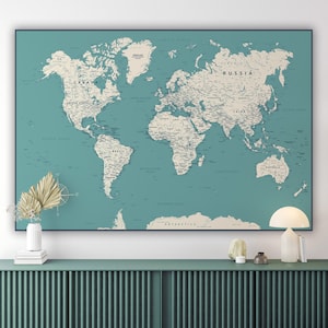 May include: A vintage-style world map print with a teal background and white text. The map shows the continents and oceans of the world, with major cities and countries labelled.