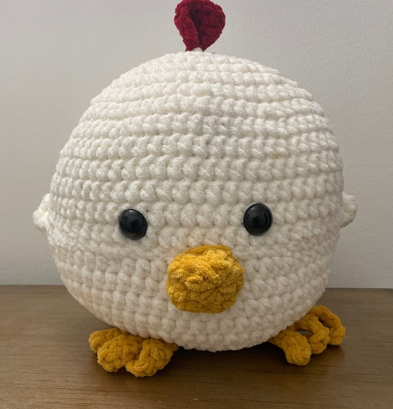 12 inch tall, handmade chicken. Super soft yarn, washable.