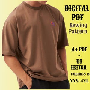 May include: A digital PDF sewing pattern for a brown t-shirt. The pattern includes instructions and maps for sizes XXS-4XL. The pattern is available in A4 and US Letter sizes.