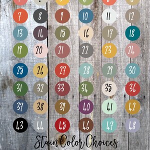 May include: A wooden board displays paint and stain color options. The image features 48 paint color choices numbered 1-48, and 6 stain color choices numbered 49-54. The text "Paint Color Choices" and "Stain Color Choices" are at the top and bottom.