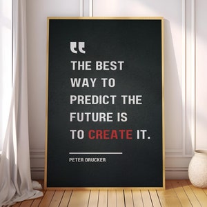 May include: A black and white motivational quote poster with a gold frame. The quote reads "The best way to predict the future is to create it." and is attributed to Peter Drucker.