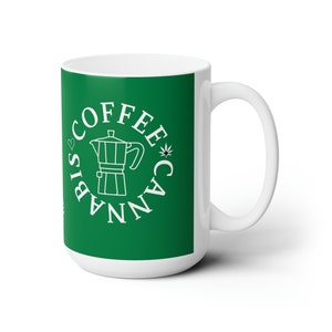 May include: White ceramic mug with a green background and a white circle design. The circle features a coffee pot, a cannabis leaf, and the text "Coffee Cannabis Biscotti".