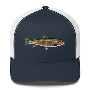 May include: A navy blue and white trucker hat with an embroidered rainbow trout on the front.