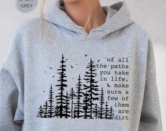 May include: Sport grey hoodie with a black forest graphic and the quote, "Of all the paths you take in life, make sure a few of them are dirt." The hoodie has a drawstring hood and a front pocket.