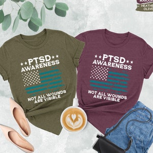 two t - shirts with the words psd awareness and not all wound are visible