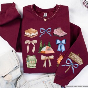 a pair of jeans and a sweater with different items on it