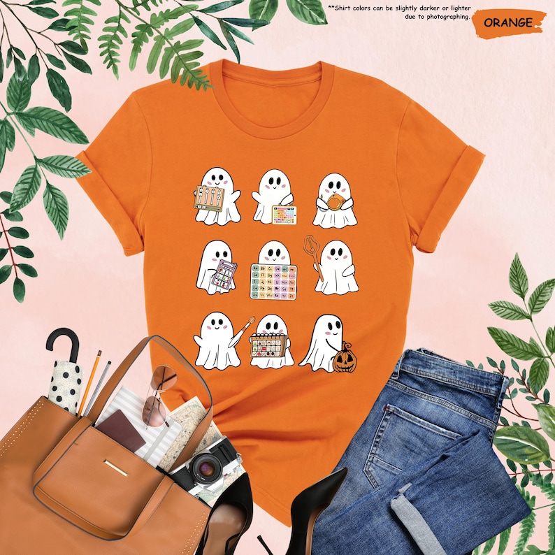 a women's orange shirt with ghost characters on it