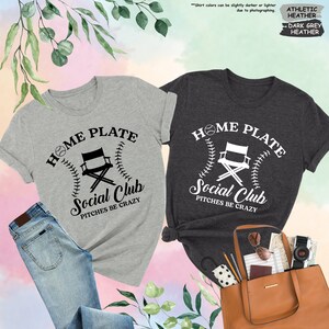 a couple of shirts that are next to a purse
