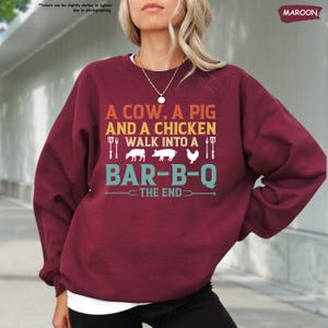 a woman with blonde hair wearing a red sweater