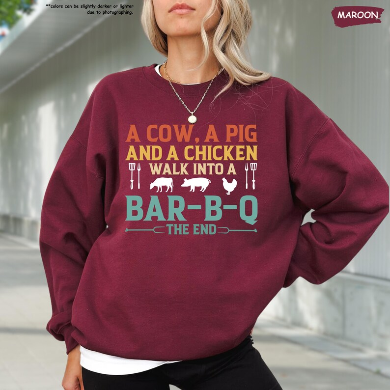 a woman with blonde hair wearing a red sweater