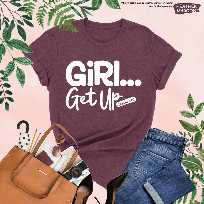a t - shirt that says girl get up next to a pair of jeans and