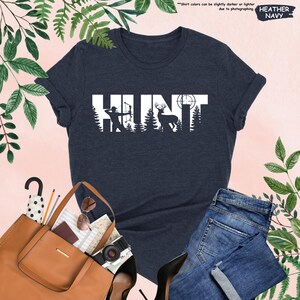 a women's t - shirt with the word hunt printed on it
