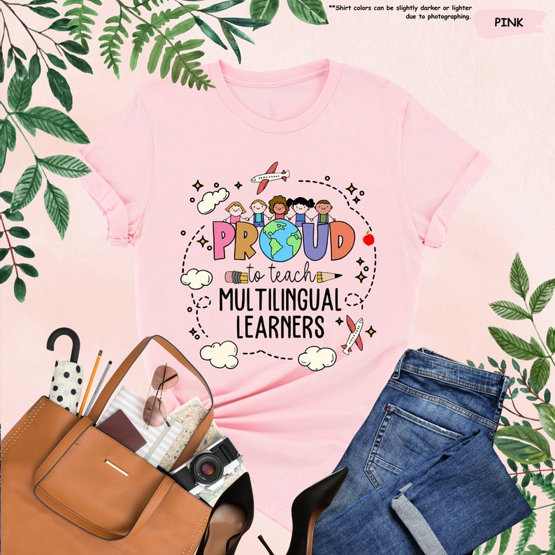 a pink t - shirt that says proud is a multilingual learner